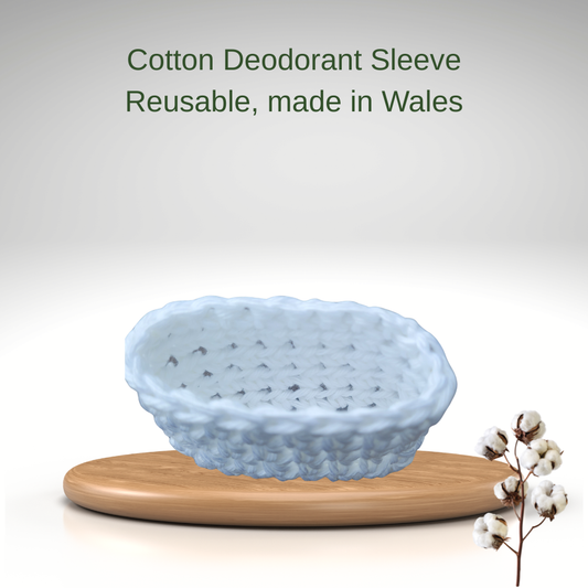 Reusable cotton deodorant sleeve on a wooden stand with text 'Cotton Deodorant Sleeve Reusable, made in Wales' on a light gray background.