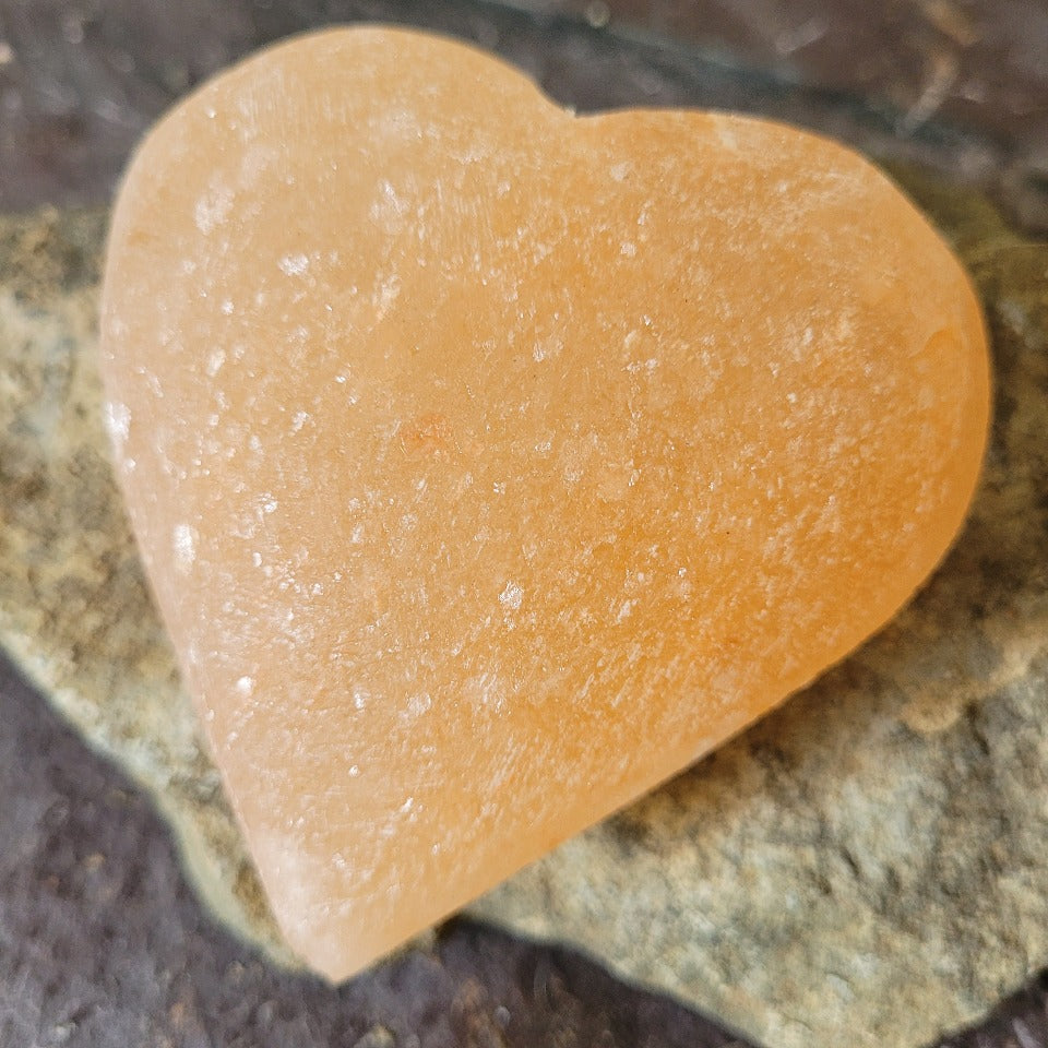 A mineral salt stone deodorant on a stone background