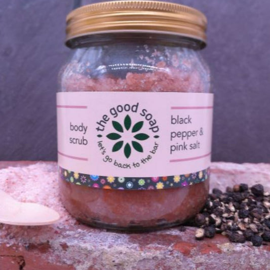 A jar of natural salt scrub, with pink himalayan salt and black pepper essential oil