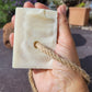 Soap on a rope held in a hand