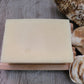 A Good Soap Aloe Vera Soap & Shampoo Bar without packaging on a wooden soap dish