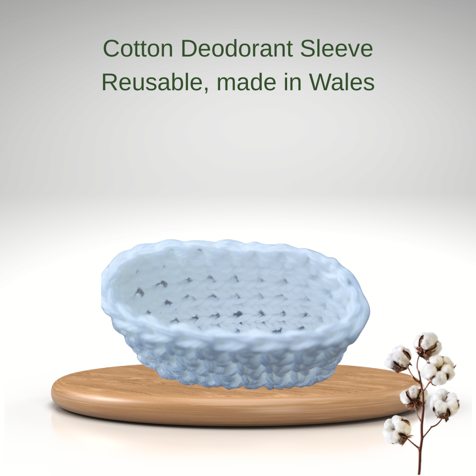 Reusable cotton deodorant sleeve on a wooden stand with text 'Cotton Deodorant Sleeve Reusable, made in Wales' on a light gray background.