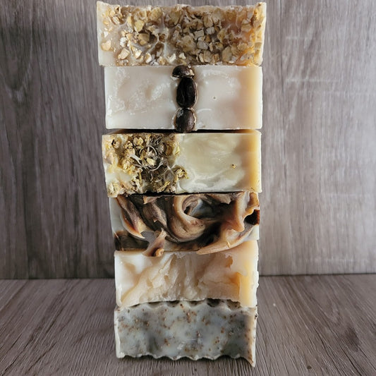 A stack of hand cut and hand decorated milk soaps by the Good Soap