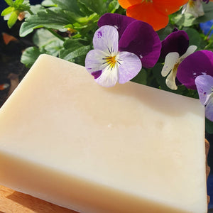 Cruelty free skin care products from The Good Soap. Aloe Vear Soap on Soap Dish a pretty tub of violoas. The Good Soap garden