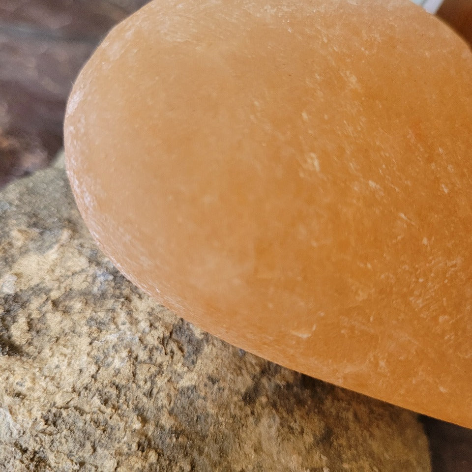 The edge view of a himalayan salt deodorant stone 