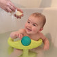  A cute baby in the bath being washed with a natural baby soap bar