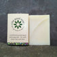 Aloe vera handmade soap and shampoo bar on a stone background. One is packaged, one is unpackaged