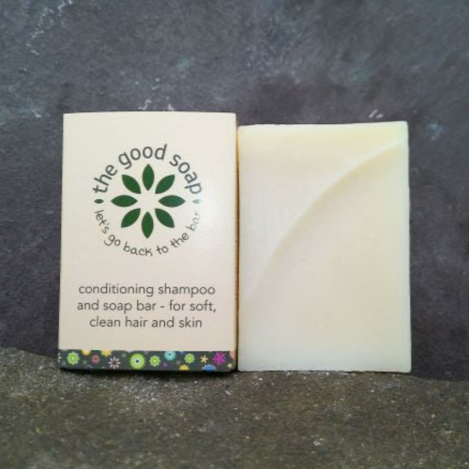 Aloe vera handmade soap and shampoo bar on a stone background. One is packaged, one is unpackaged
