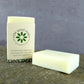 Aloe Vera Soap Bar & Shampoo standing on a stone background in packaging
