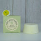 A natural baby soap bar, boxed and decorated by a pretty yellow flower