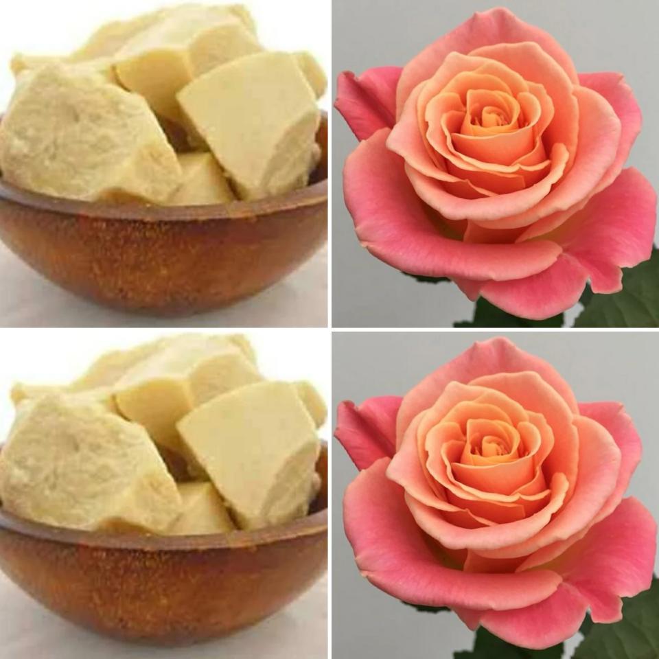 A wooden bowl of cocoa butter and some roses