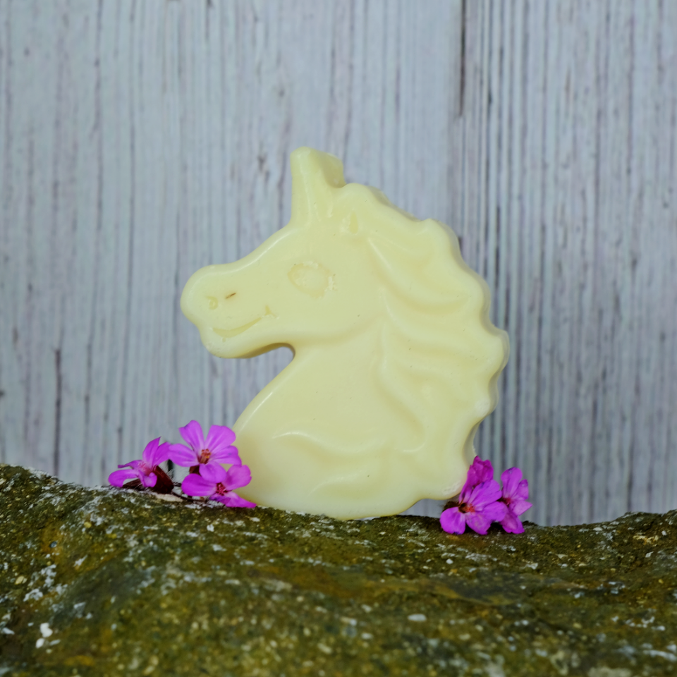 Sparkle Unicorn Children's Soap on a stone background with pretty pink flowers