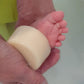 Natural Baby Soap being used on a baby's foot